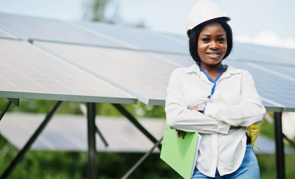 Young engineer at a solar power station, an example of growing careers in renewable energy